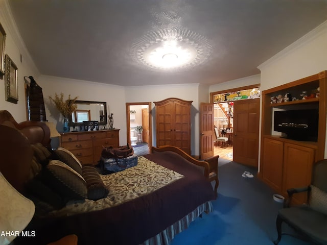 carpeted bedroom featuring crown molding