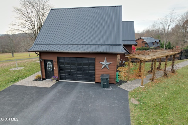 view of side of property with a lawn, a garage, and an outdoor structure