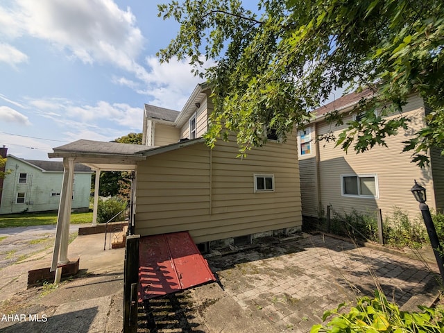 rear view of property featuring a patio area