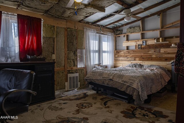 bedroom with visible vents, ceiling fan, and vaulted ceiling