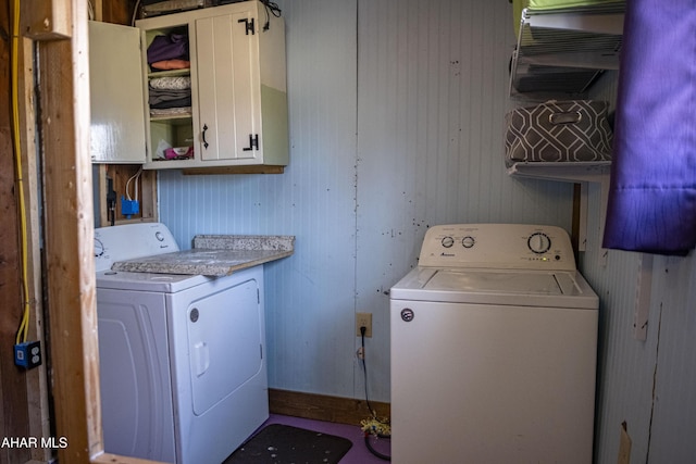 washroom with cabinet space and independent washer and dryer