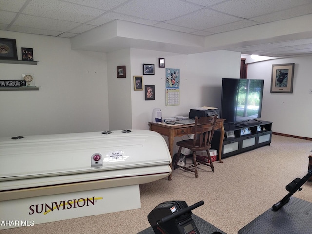 carpeted bedroom with a paneled ceiling