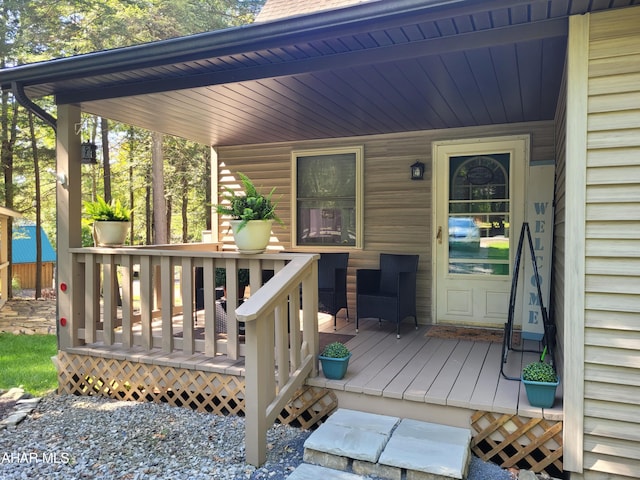 wooden deck featuring covered porch