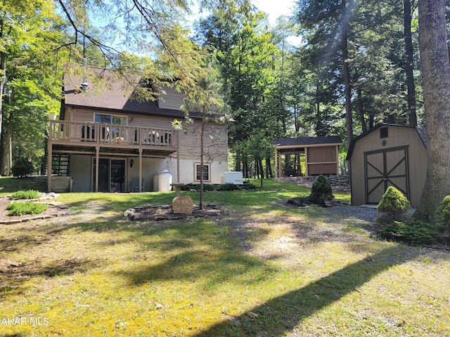 view of yard featuring a shed and a wooden deck