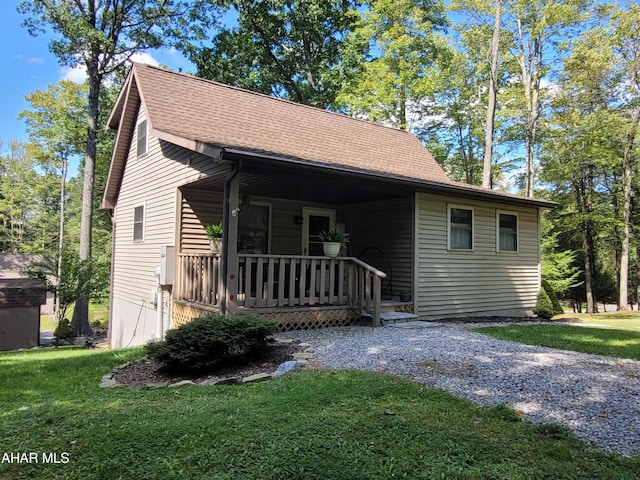 view of front of home with a front lawn and a porch