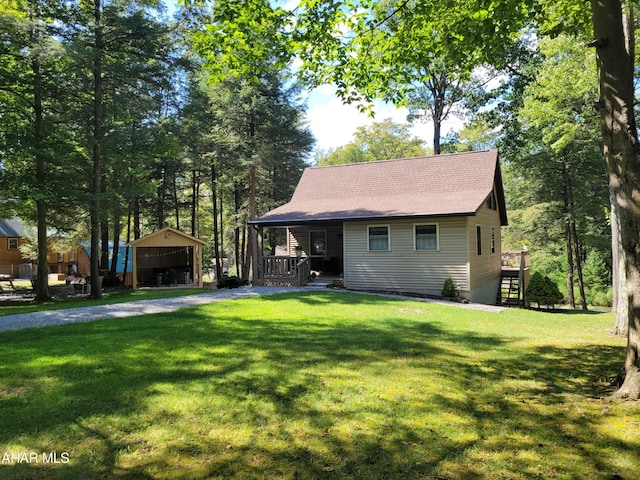 view of front facade with stairs, a porch, a front yard, and a shingled roof