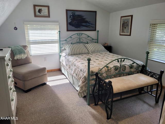 carpeted bedroom featuring a textured ceiling and vaulted ceiling