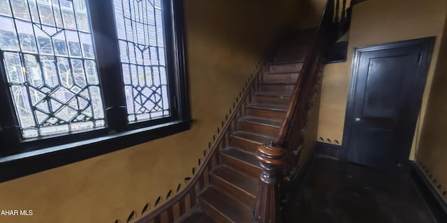 staircase featuring plenty of natural light