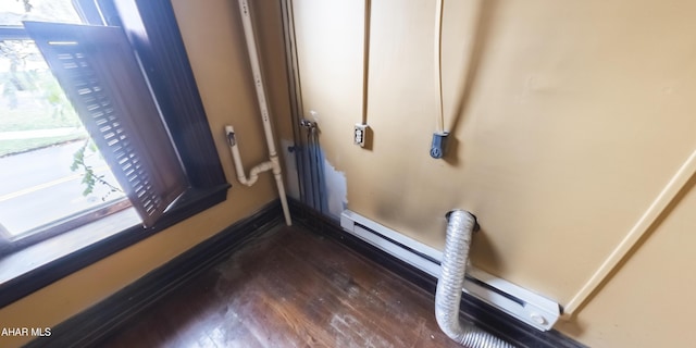 room details with wood-type flooring and a baseboard heating unit