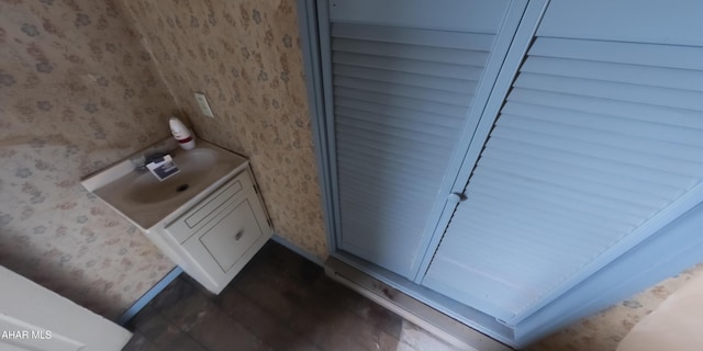 bathroom with hardwood / wood-style floors