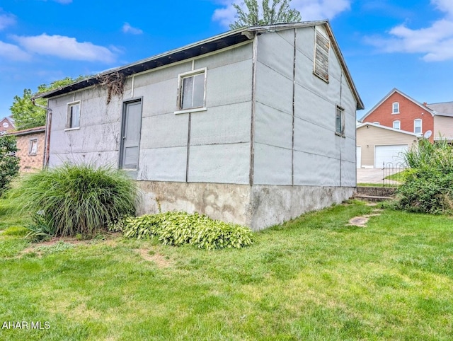 902 Main St, Saxton, PA 16678 - view of property exterior featuring a yard and a garage