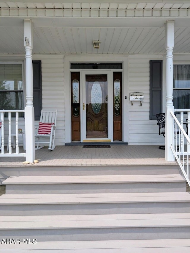 902 Main St, Saxton, PA 16678 - doorway to property featuring a porch
