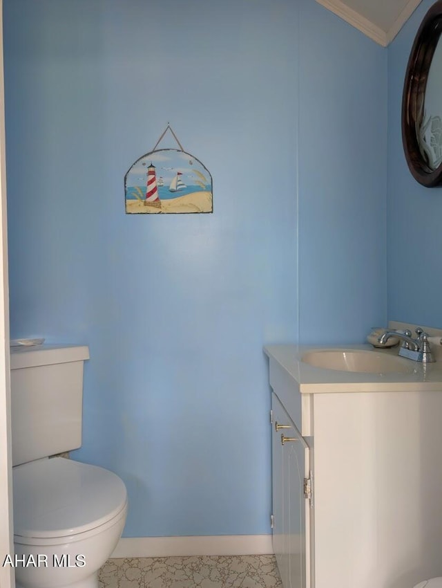 902 Main St, Saxton, PA 16678 - bathroom with toilet, vanity, ornamental molding, and baseboards