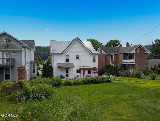 902 Main St, Saxton, PA 16678 - view of front of property featuring a pergola, a front lawn, and metal roof
