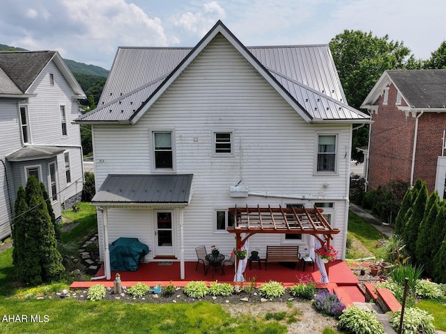 902 Main St, Saxton, PA 16678 - rear view of house featuring metal roof, a pergola, and a wooden deck