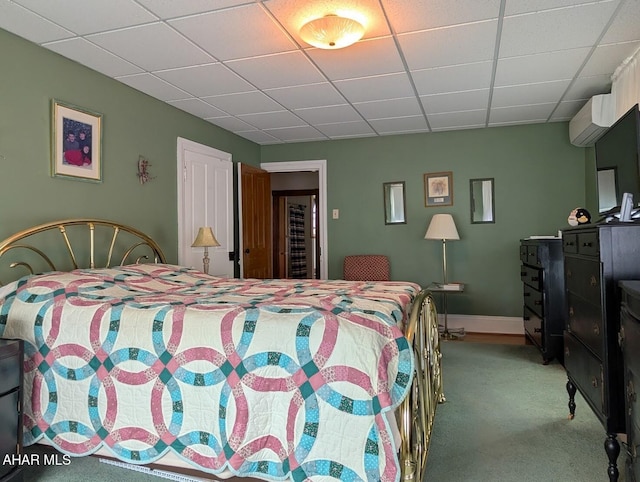 902 Main St, Saxton, PA 16678 - carpeted bedroom featuring a drop ceiling, a wall mounted AC, and baseboards