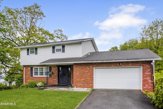 829 Ashcroft Ave, Cresson, PA 16630 - view of front of home with brick siding, driveway, a front lawn, and an attached garage