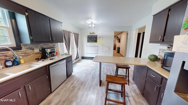 829 Ashcroft Ave, Cresson, PA 16630 - kitchen featuring dishwasher, tasteful backsplash, light wood-type flooring, and light countertops