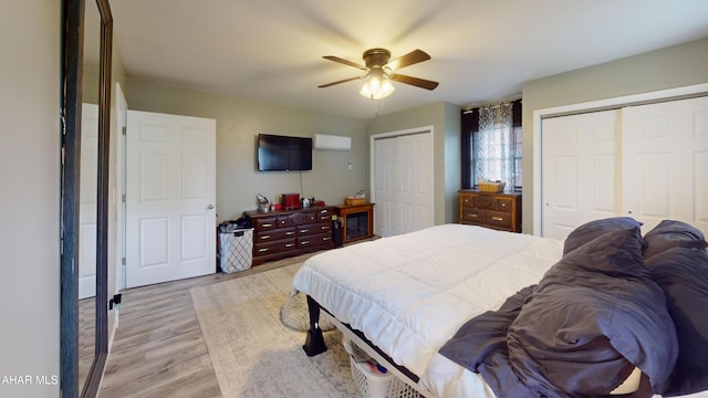 829 Ashcroft Ave, Cresson, PA 16630 - bedroom with multiple closets, light wood finished floors, and ceiling fan