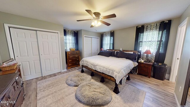 829 Ashcroft Ave, Cresson, PA 16630 - bedroom with multiple closets, light wood-type flooring, and ceiling fan