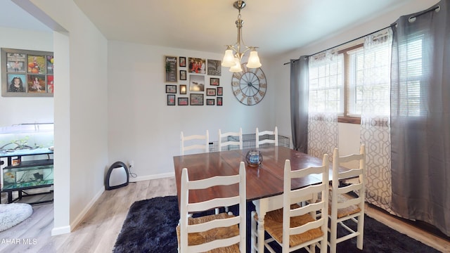 829 Ashcroft Ave, Cresson, PA 16630 - dining space featuring wood finished floors, a chandelier, and baseboards
