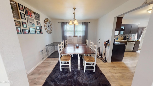 829 Ashcroft Ave, Cresson, PA 16630 - dining room with light wood finished floors, a chandelier, and baseboards