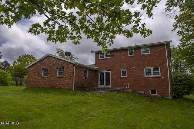 829 Ashcroft Ave, Cresson, PA 16630 - rear view of house featuring brick siding and a yard