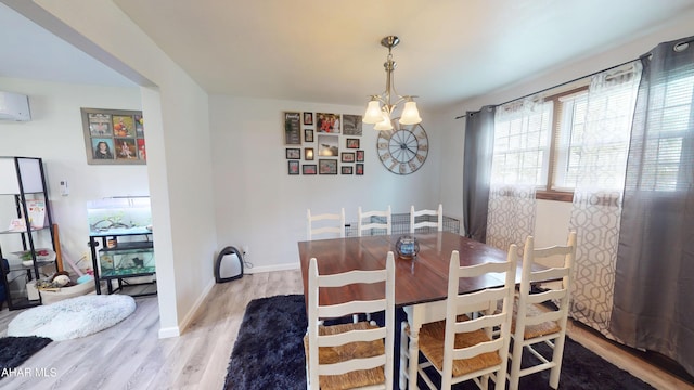 829 Ashcroft Ave, Cresson, PA 16630 - dining room with a chandelier, wood finished floors, and baseboards