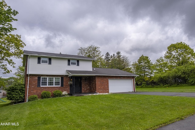 829 Ashcroft Ave, Cresson, PA 16630 - view of front of home featuring an attached garage, driveway, a front lawn, and brick siding