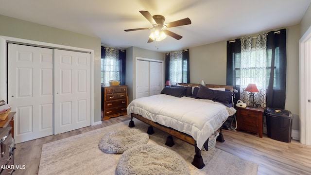 829 Ashcroft Ave, Cresson, PA 16630 - bedroom featuring multiple closets, light wood-style flooring, and a ceiling fan