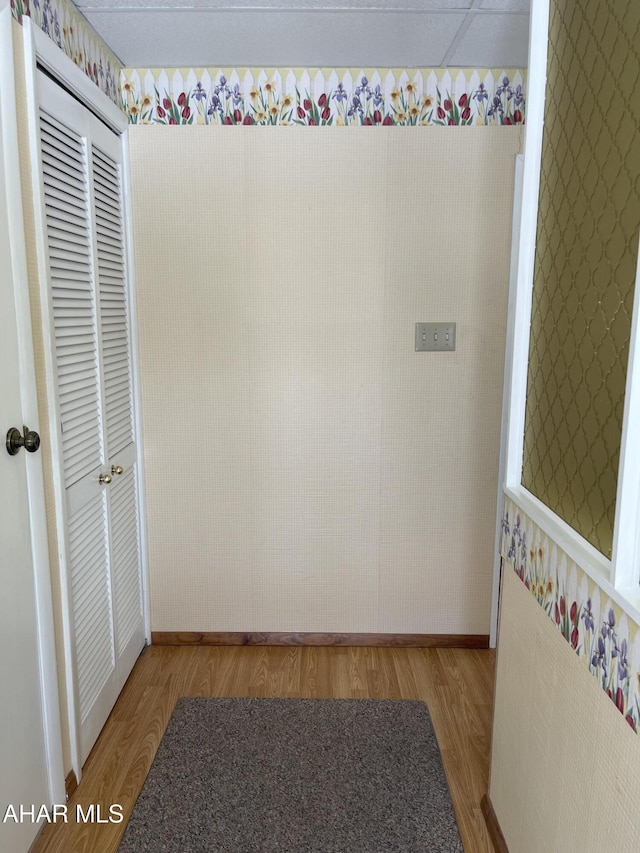 corridor with light hardwood / wood-style floors