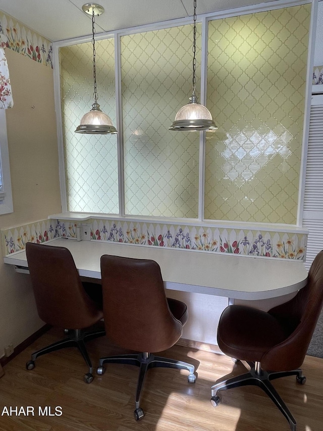 dining space with breakfast area and hardwood / wood-style flooring