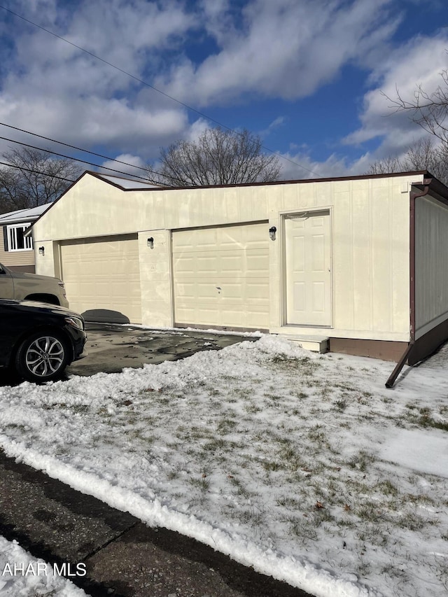 view of snow covered garage