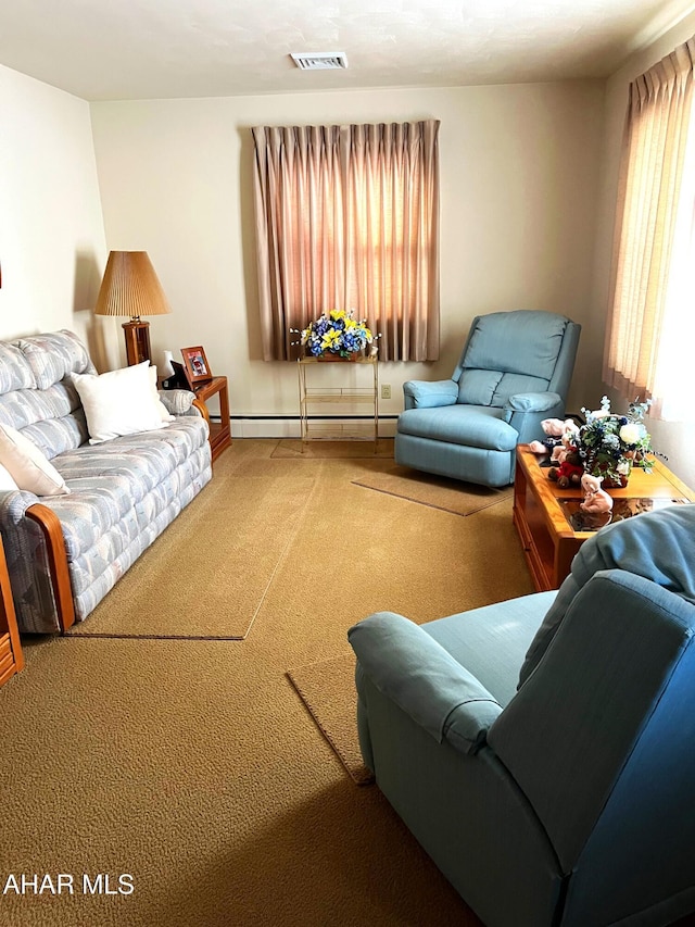 carpeted living room with baseboard heating