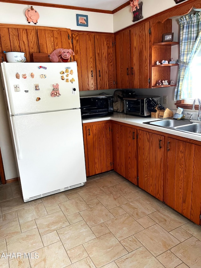 kitchen with white refrigerator and sink