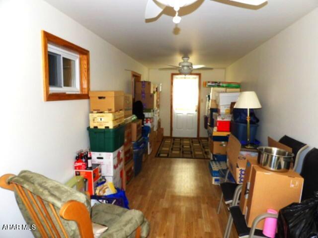 storage area featuring ceiling fan