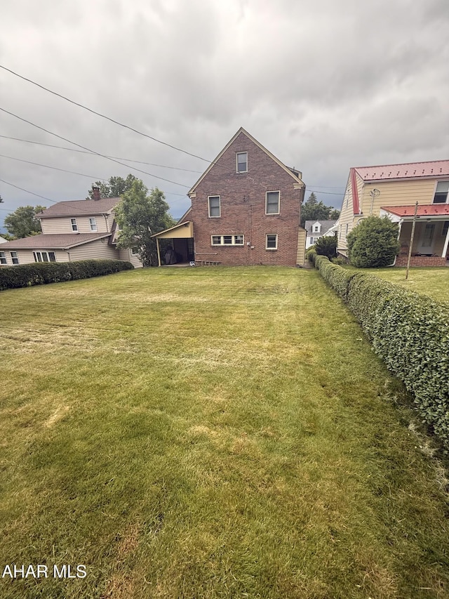 414 27th Ave, Altoona, PA 16601 - back of property with brick siding and a lawn