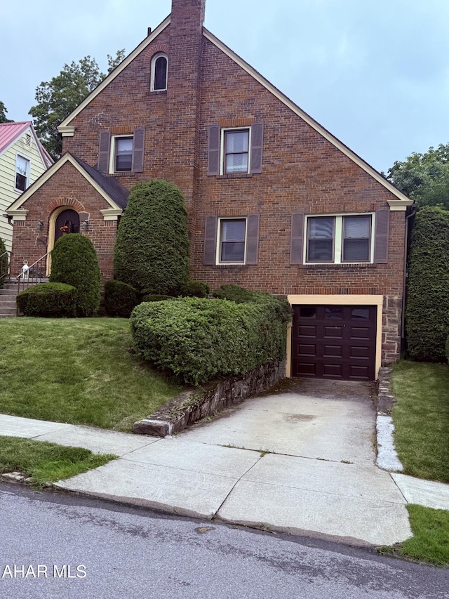 414 27th Ave, Altoona, PA 16601 - view of property exterior featuring concrete driveway, a garage, a lawn, brick siding, and a chimney