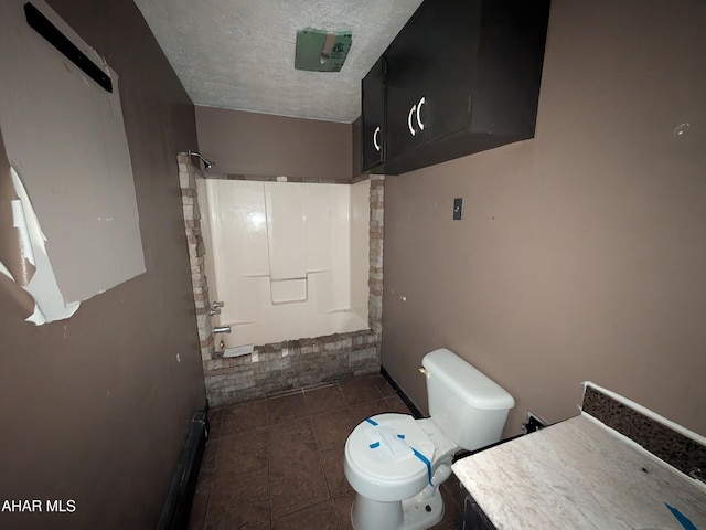 full bathroom with tile patterned floors, vanity, a textured ceiling, shower / washtub combination, and toilet