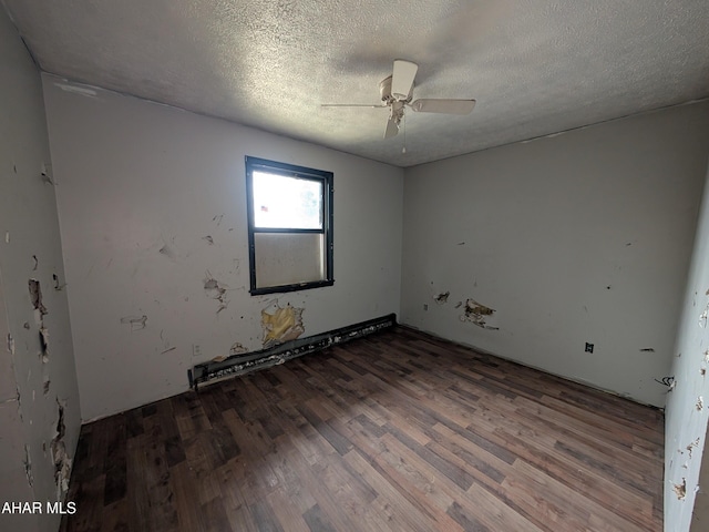 unfurnished room featuring hardwood / wood-style flooring, ceiling fan, and a textured ceiling