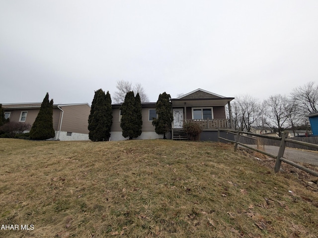 view of front of home featuring covered porch and a front lawn