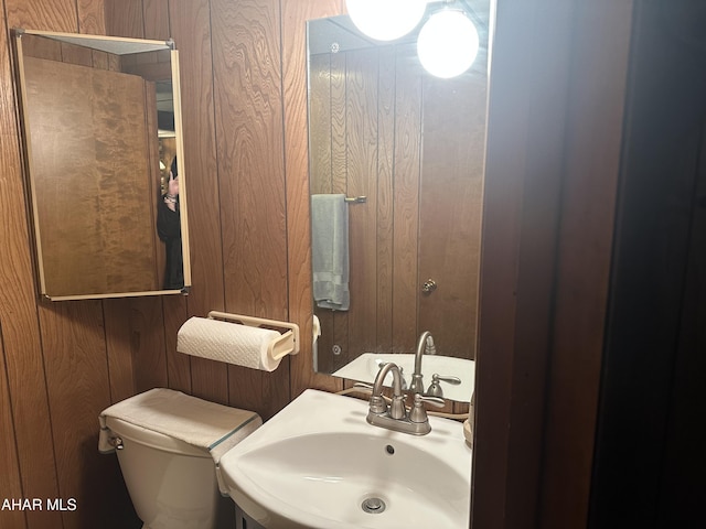 159 Hollidaysburg Sportsman Rd, Hollidaysburg, PA 16648 - half bathroom with a sink, wood walls, and toilet