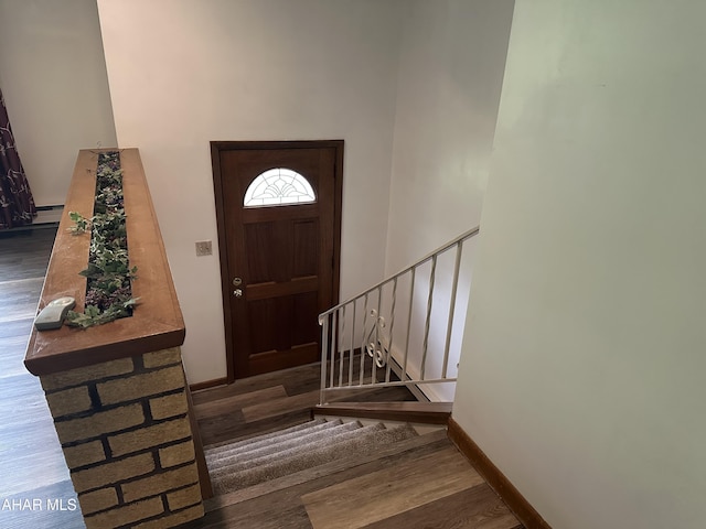 159 Hollidaysburg Sportsman Rd, Hollidaysburg, PA 16648 - entrance foyer featuring wood finished floors, a baseboard radiator, baseboards, stairway, and a towering ceiling