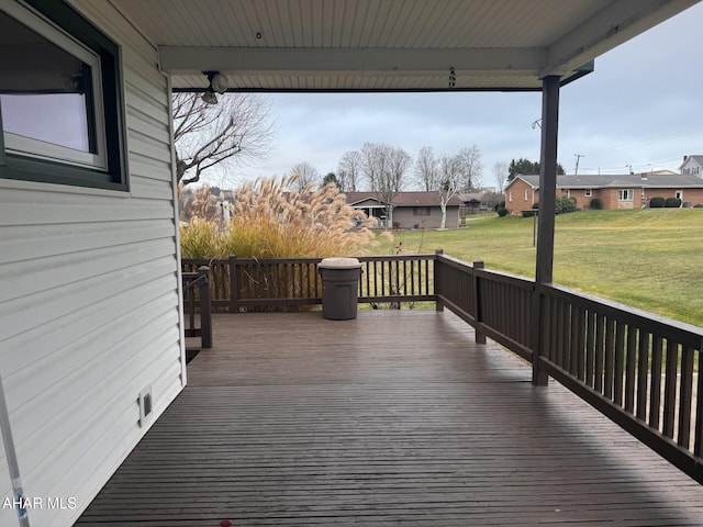 wooden terrace with a yard