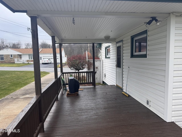 wooden terrace with a porch