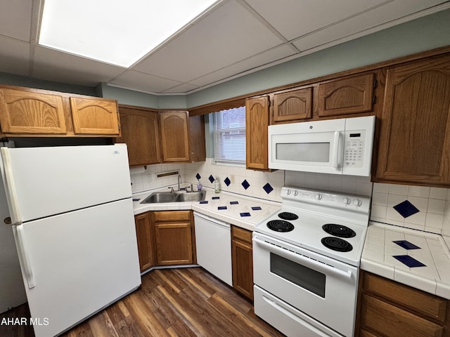 2123 2nd Ave, Altoona, PA 16602 - kitchen featuring dark wood finished floors, a sink, tile countertops, white appliances, and backsplash