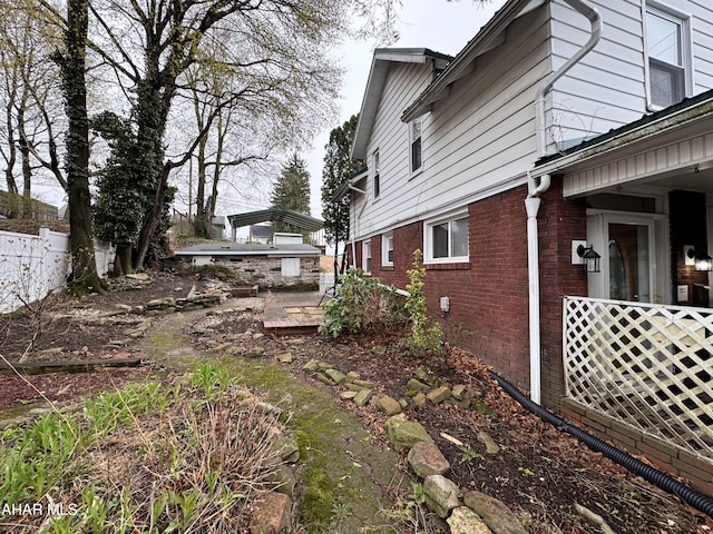 2123 2nd Ave, Altoona, PA 16602 - view of side of home with fence and brick siding