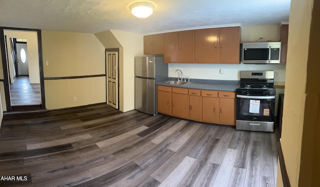 1904 2nd Ave, Altoona, PA 16602 - kitchen featuring appliances with stainless steel finishes, dark wood-style flooring, a sink, and dark countertops
