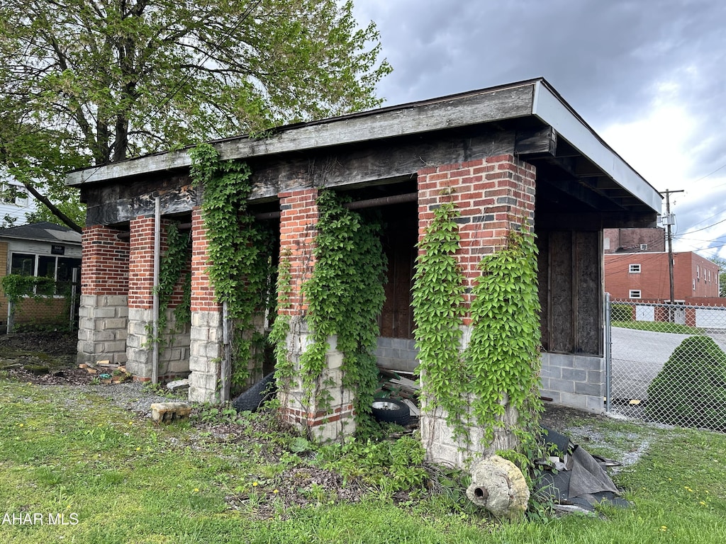 view of outdoor structure with fence