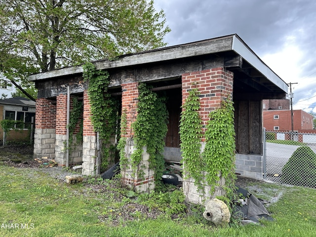 view of outdoor structure with fence